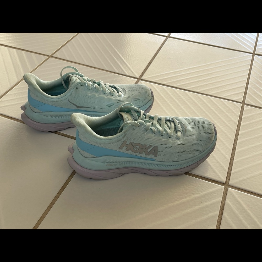 HOKA ONE mint green sneakers.